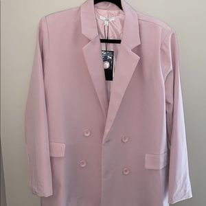 This is an adorable light pink blazer